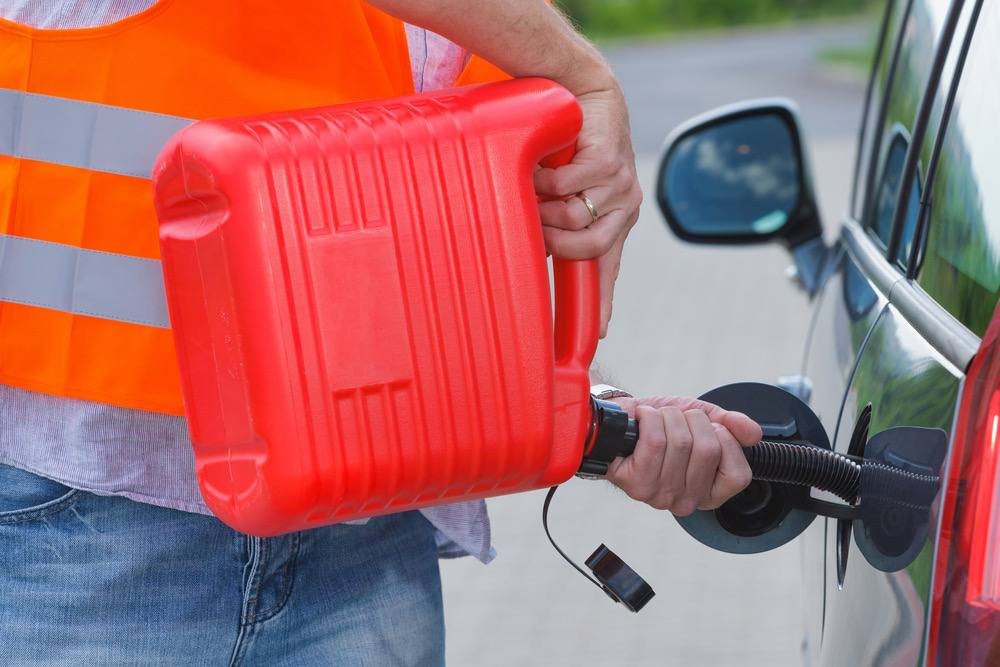 Fuel being poured into a car's gas tank
